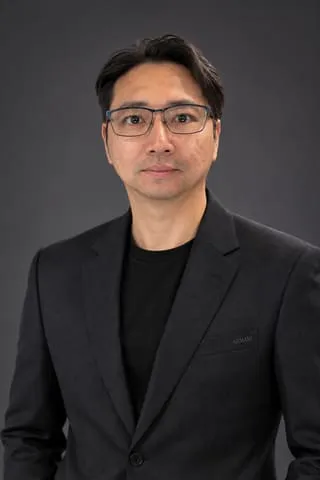 AI-generated studio portrait of Phillip Tham, made at AI Odyssey, September 2026