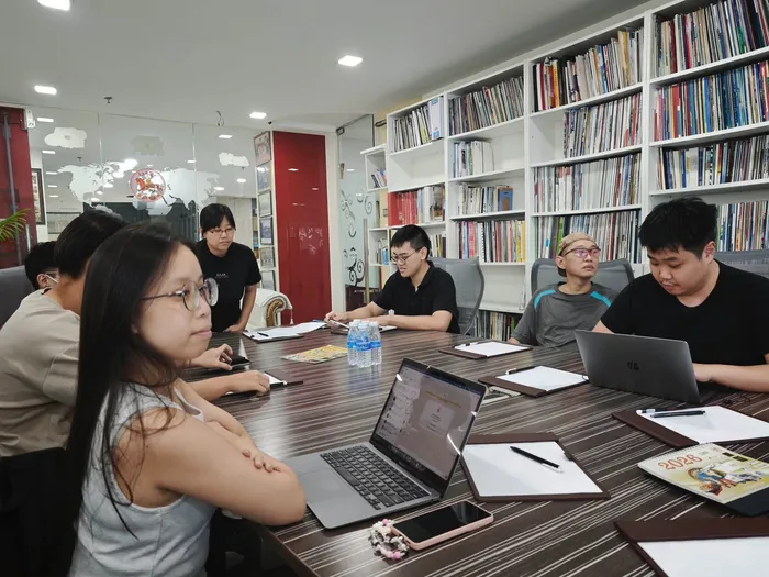 Heads down at a client's boardroom